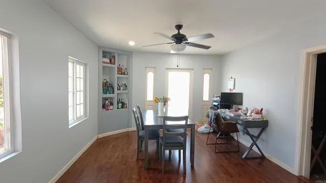 a view of a livingroom with furniture and a window