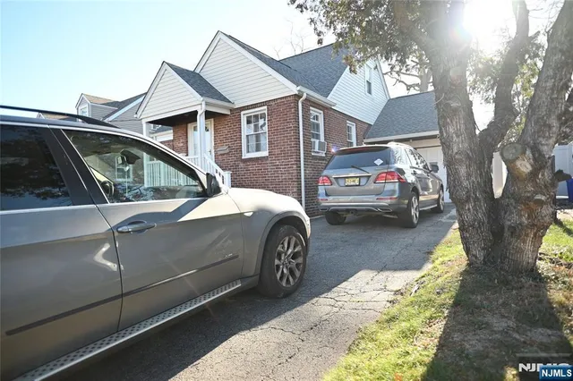 a view of a car parked in front of a house
