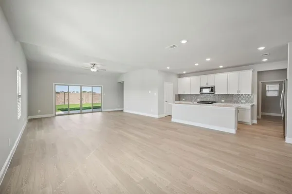 a view of kitchen with kitchen island sink and center island