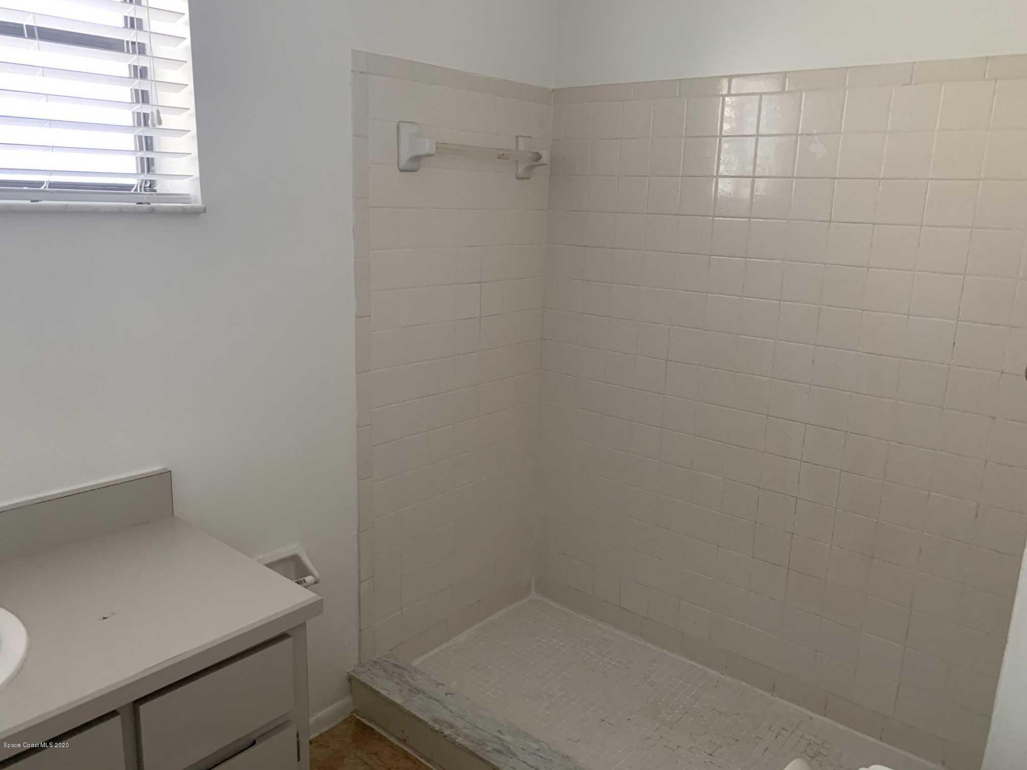 2222 Flower Tree Circle Melbourne, FL 32935 - Photo 14 of 17 a bathroom with a sink and cabinets