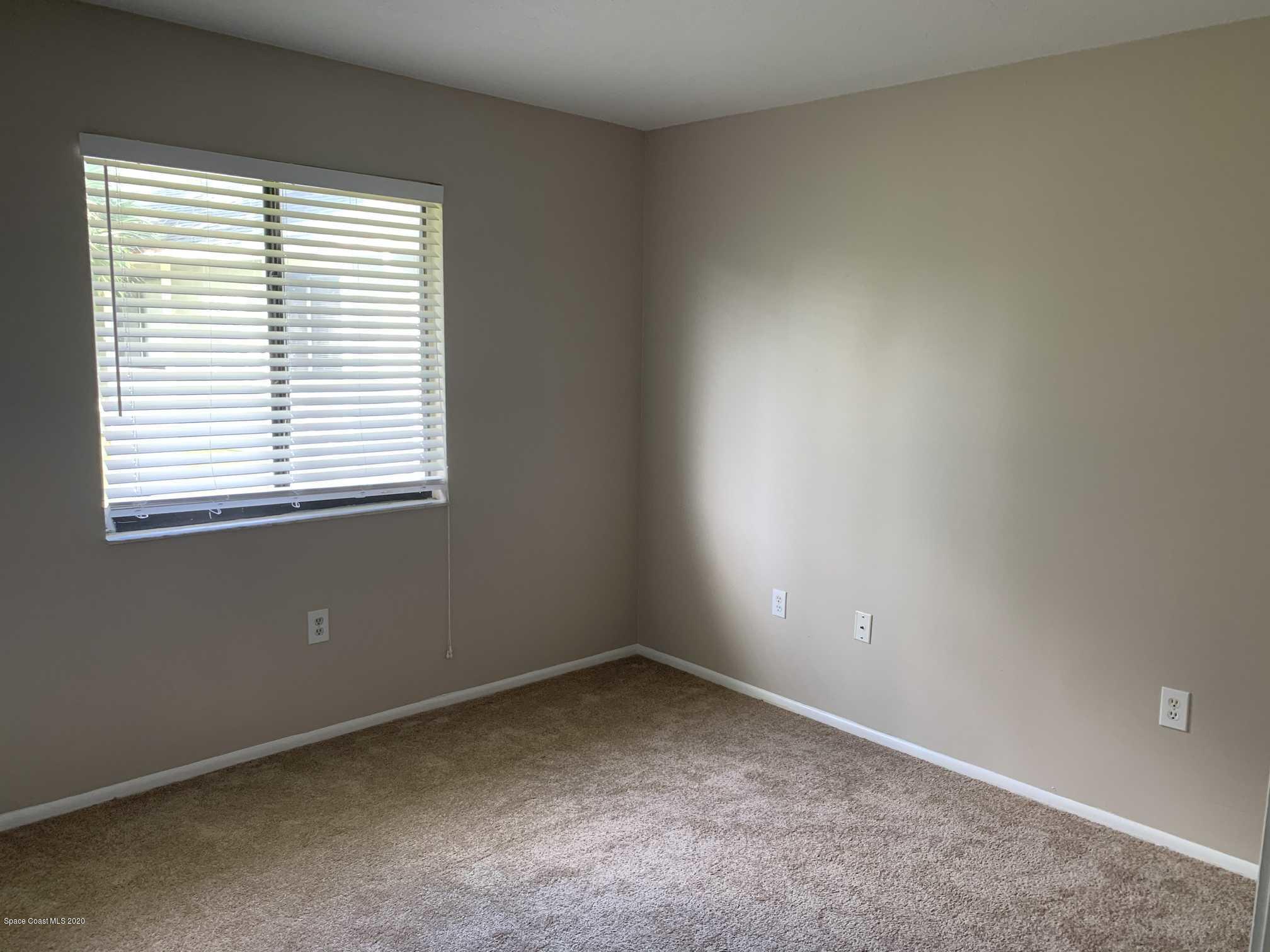 2222 Flower Tree Circle Melbourne, FL 32935 - Photo 9 of 17 an empty room with a window