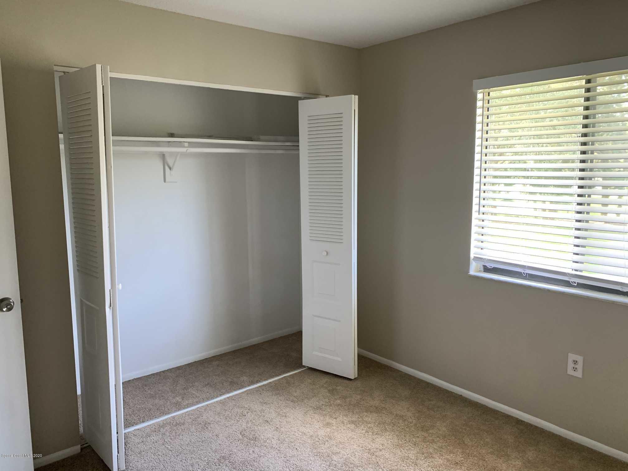 2222 Flower Tree Circle Melbourne, FL 32935 - Photo 10 of 17 a view of an empty room with a window