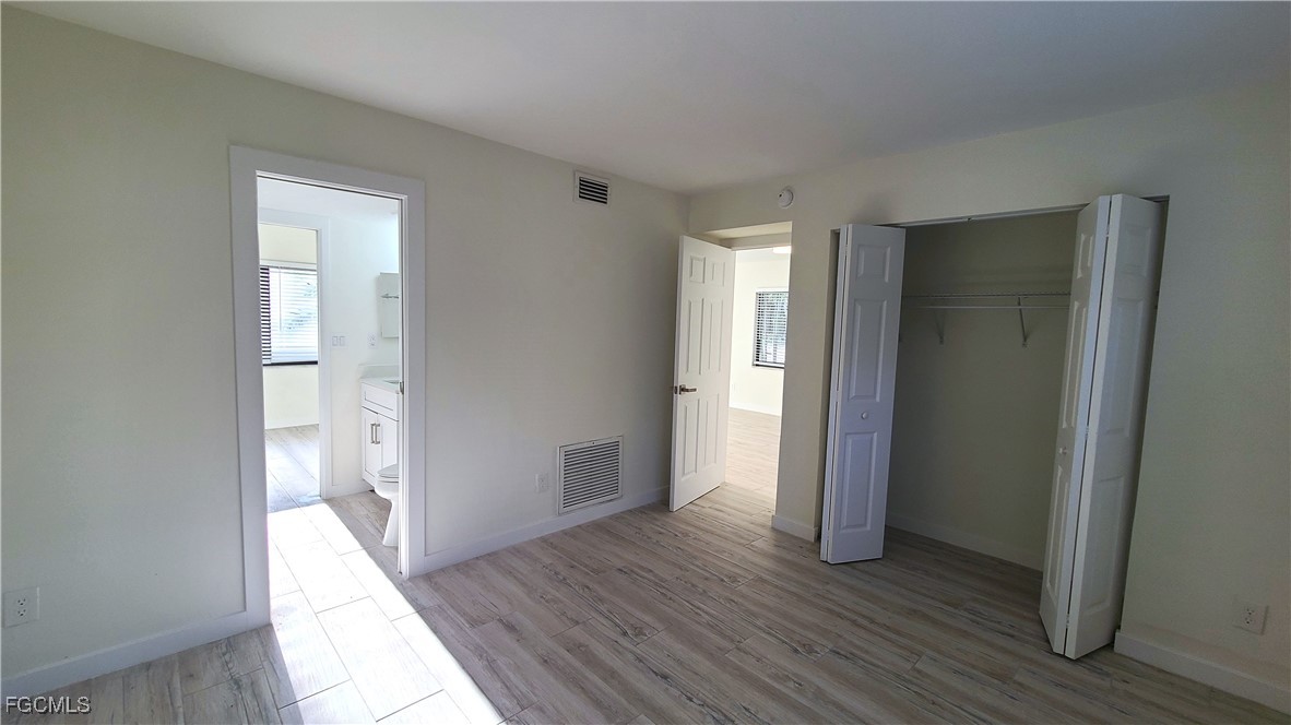 2610 Providence Street, Unit 1 Fort Myers, FL 33916 - Photo 13 of 16 a view of hallway with wooden floor