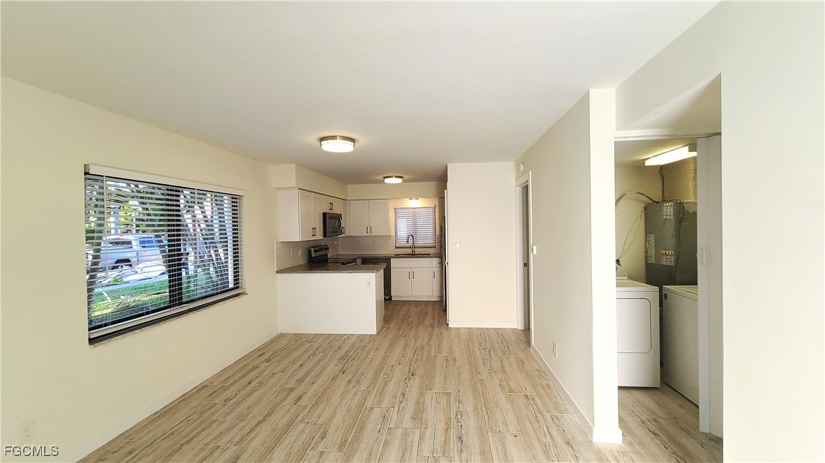 2610 Providence Street, Unit 1 Fort Myers, FL 33916 - Photo 6 of 16 a kitchen with a refrigerator and a stove