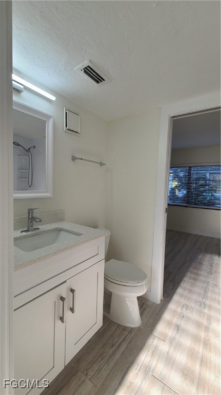 2610 Providence Street, Unit 1 Fort Myers, FL 33916 - Photo 9 of 16 a bathroom with a sink toilet and vanity