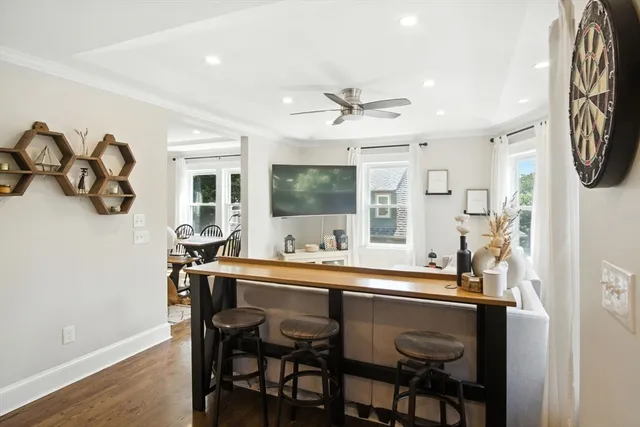 a dining room with furniture and window