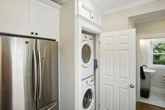a view of a hallway with washer and dryer