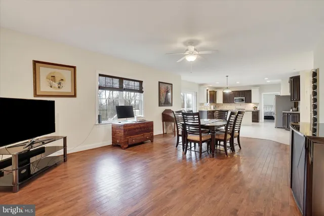 a spacious bedroom with a bed and a window