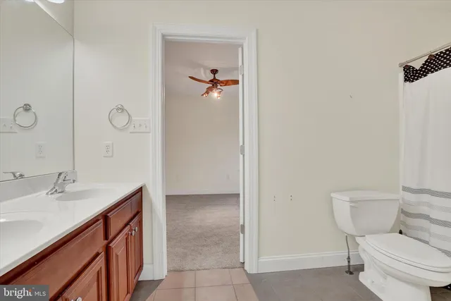 a view of deck with wooden floor and fence with a trees