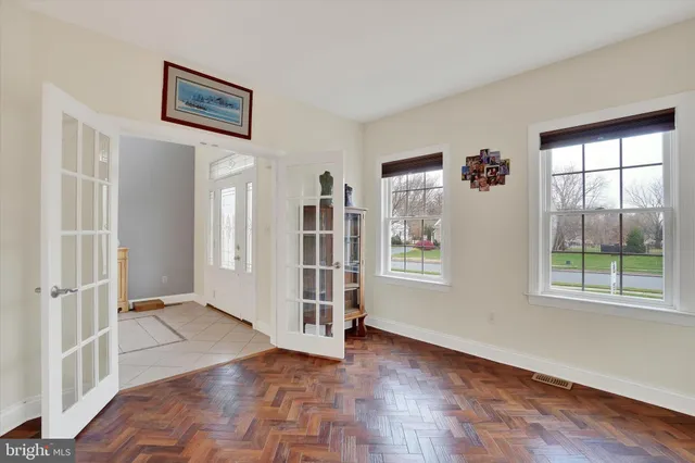 a large kitchen with stainless steel appliances granite countertop a stove top oven a refrigerator and a granite counter tops