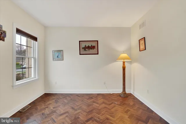 a large kitchen with stainless steel appliances granite countertop a stove a sink a dining table and chair