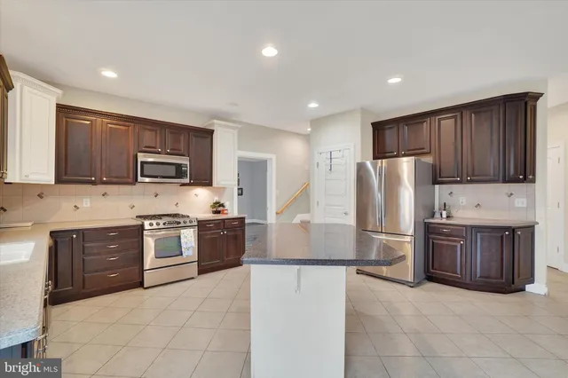 a view of a dining room with furniture and a flat screen tv