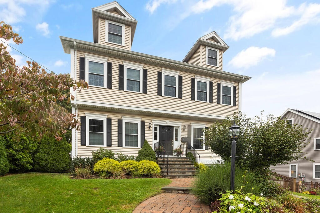 11 Kenilworth Road Arlington, MA 02476 - Photo 1 of 33 a front view of a house with garden and porch