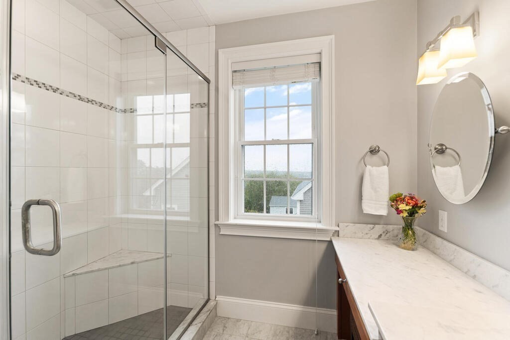 11 Kenilworth Road Arlington, MA 02476 - Photo 20 of 33 a bathroom with a sink and a mirror