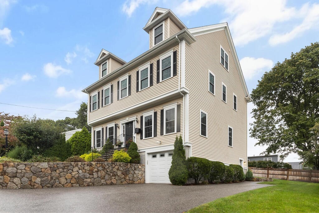 11 Kenilworth Road Arlington, MA 02476 - Photo 2 of 33 a front view of a house with a yard