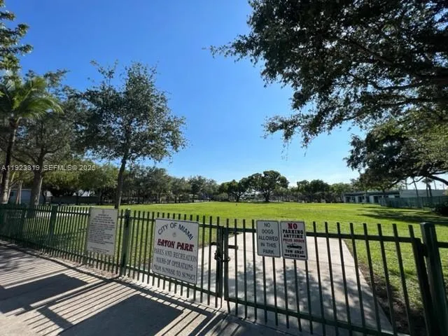 a kitchen with a sink and a refrigerator
