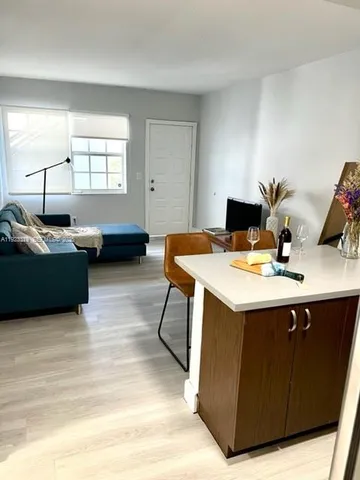 a view of a livingroom with furniture and window