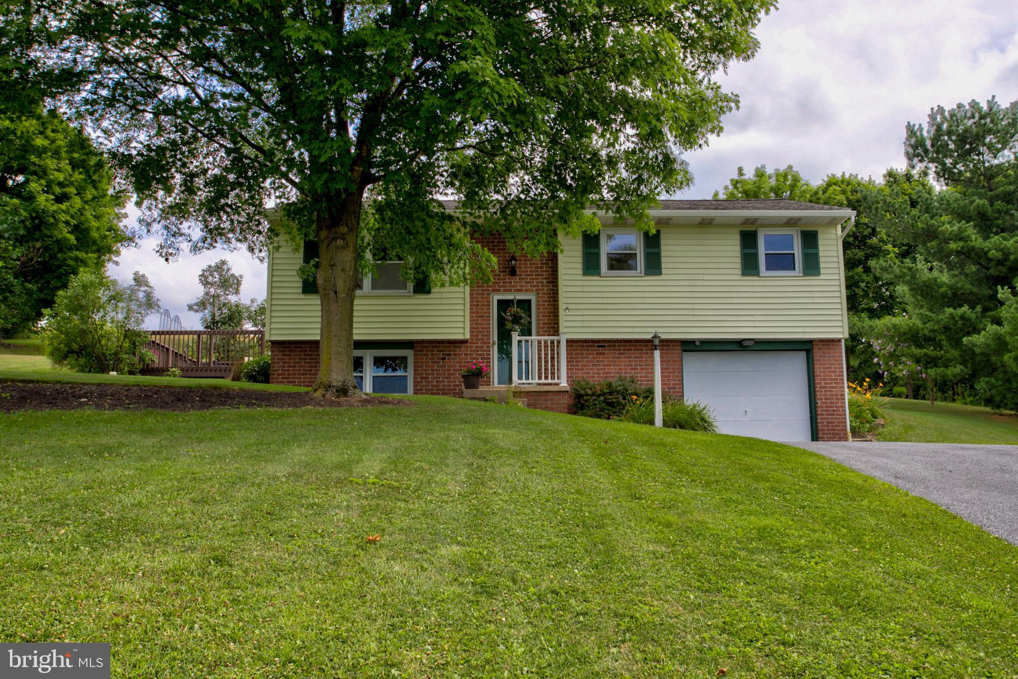 316 Long Lane Lititz, PA 17543 - Photo 1 of 49 a front view of a house with a garden