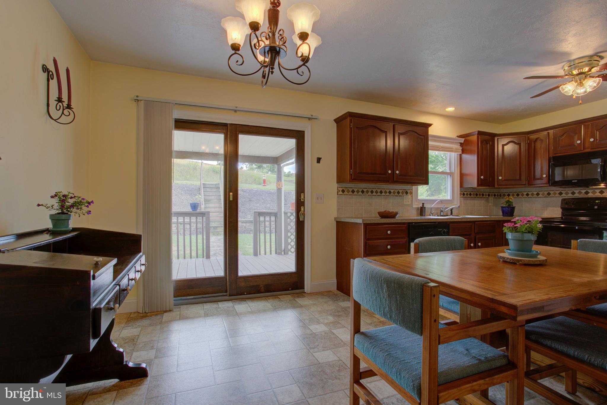 316 Long Lane Lititz, PA 17543 - Photo 15 of 49 a kitchen with a stove a refrigerator and a dining table