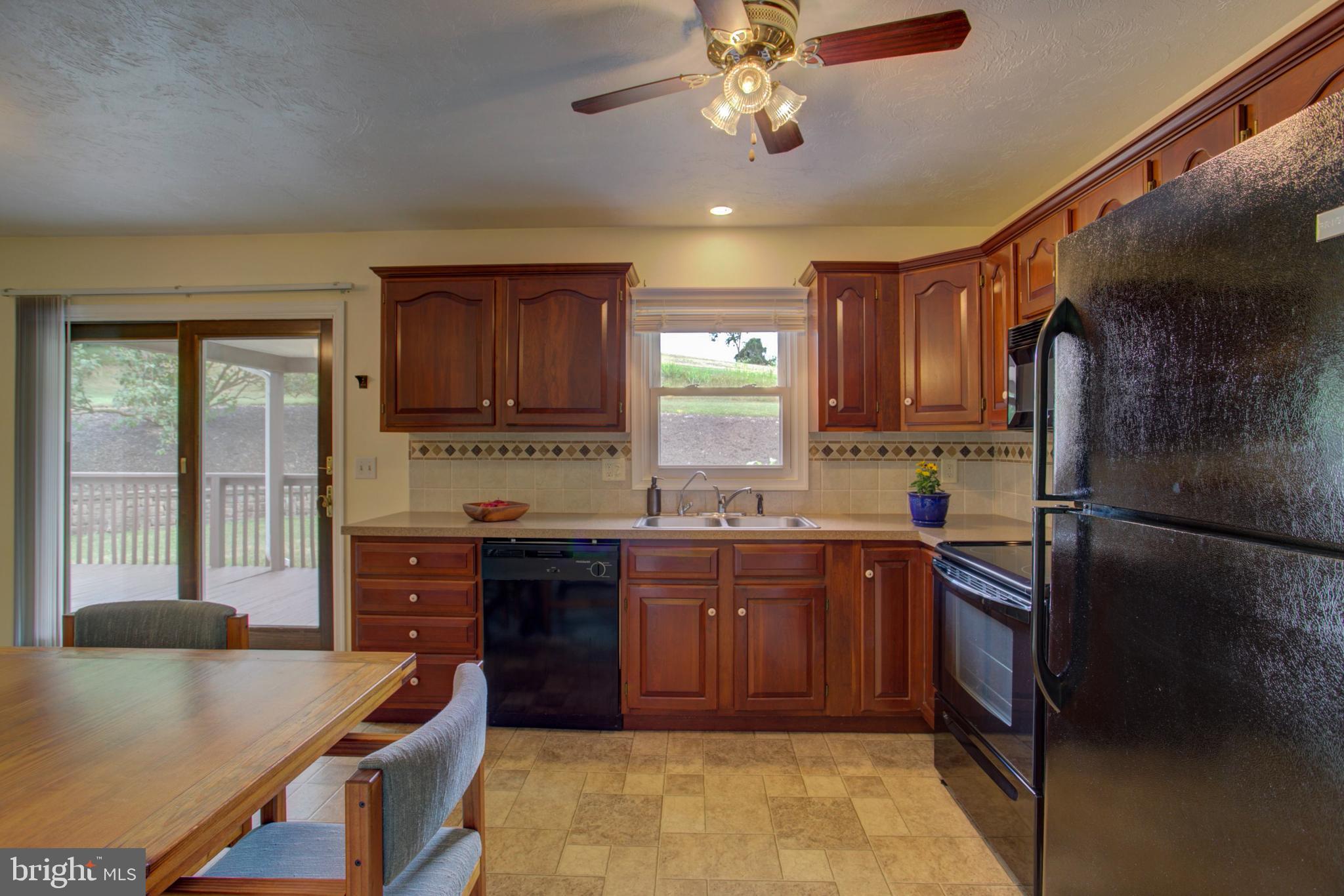 316 Long Lane Lititz, PA 17543 - Photo 17 of 49 a kitchen with a refrigerator and a stove top oven
