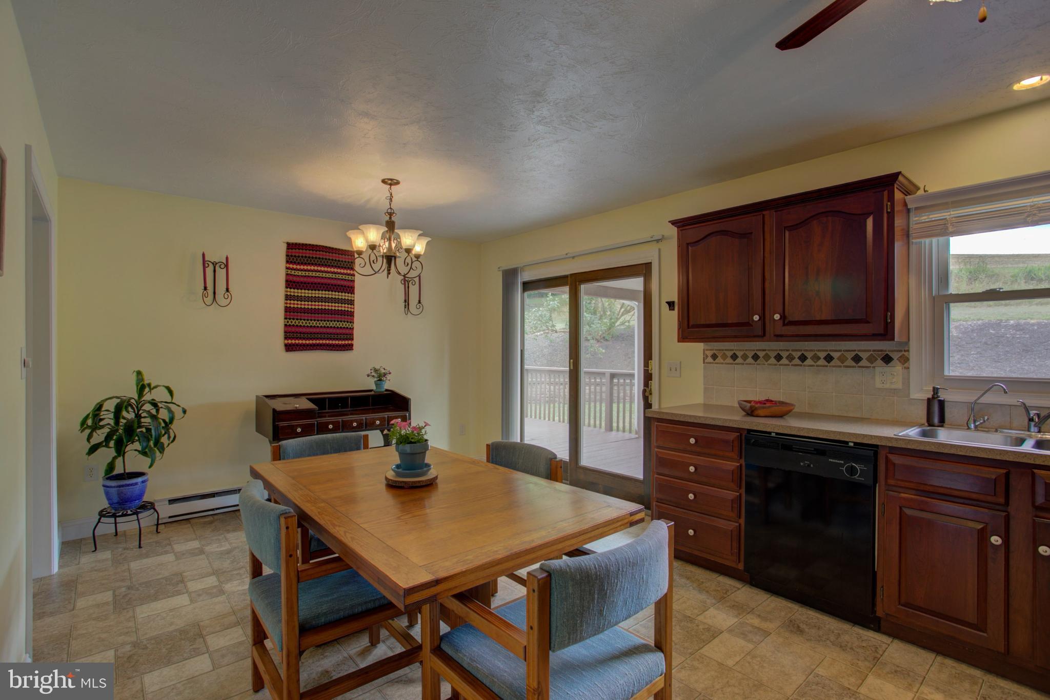 316 Long Lane Lititz, PA 17543 - Photo 18 of 49 a kitchen with a cabinets appliances and a dining table