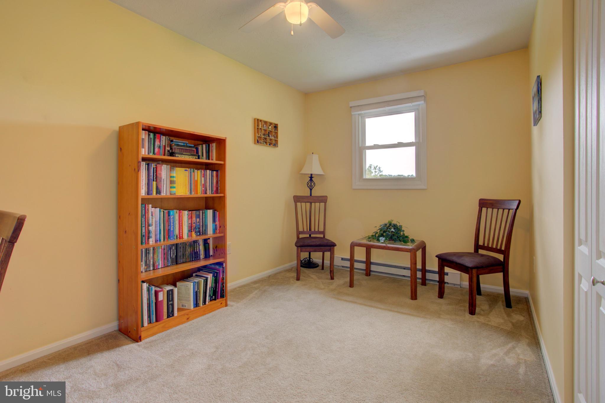316 Long Lane Lititz, PA 17543 - Photo 25 of 49 a living room with furniture and a book shelf