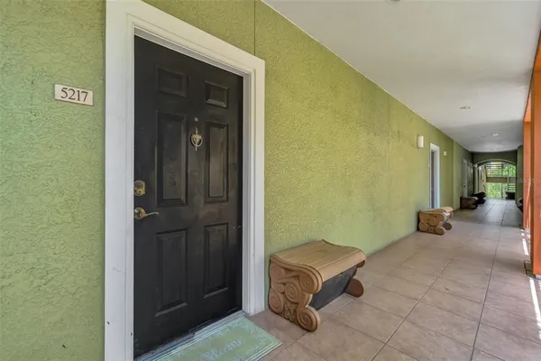 a view of a hallway with a furniture