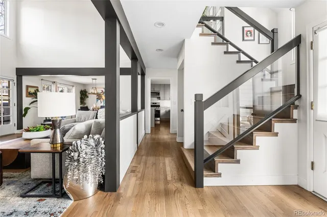 a view of entryway and hall with wooden floor