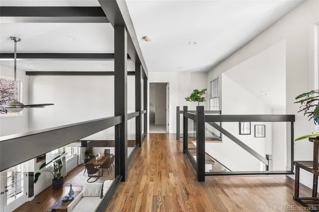 a view of entryway and hall with wooden floor