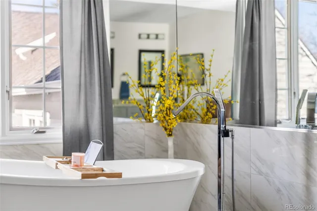 a bathroom with a bathtub and a sink