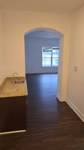 a bathroom with a bathtub sink and mirror