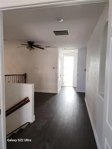 a bathroom with a bathtub a sink and a mirror