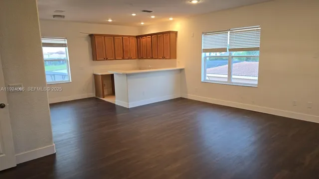 a view of a balcony with an empty space and wooden floor