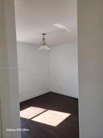 an empty room with a empty space and a window