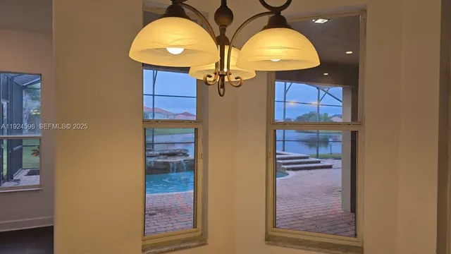 a view of a hallway with a chandelier