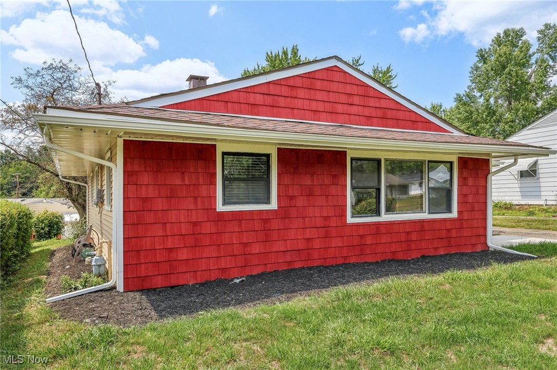 38 Rutledge Drive Youngstown, OH 44505 - Photo 2 of 32 View of home's exterior featuring roof with shingles and a lawn