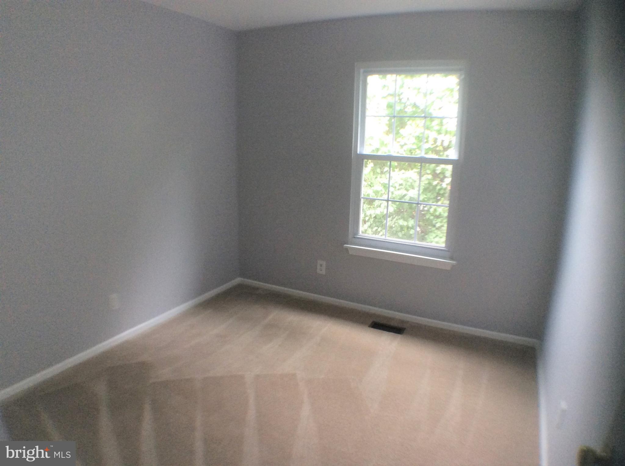 2021 Putnam Road Baltimore, MD 21227 - Photo 14 of 18 an empty room with a window