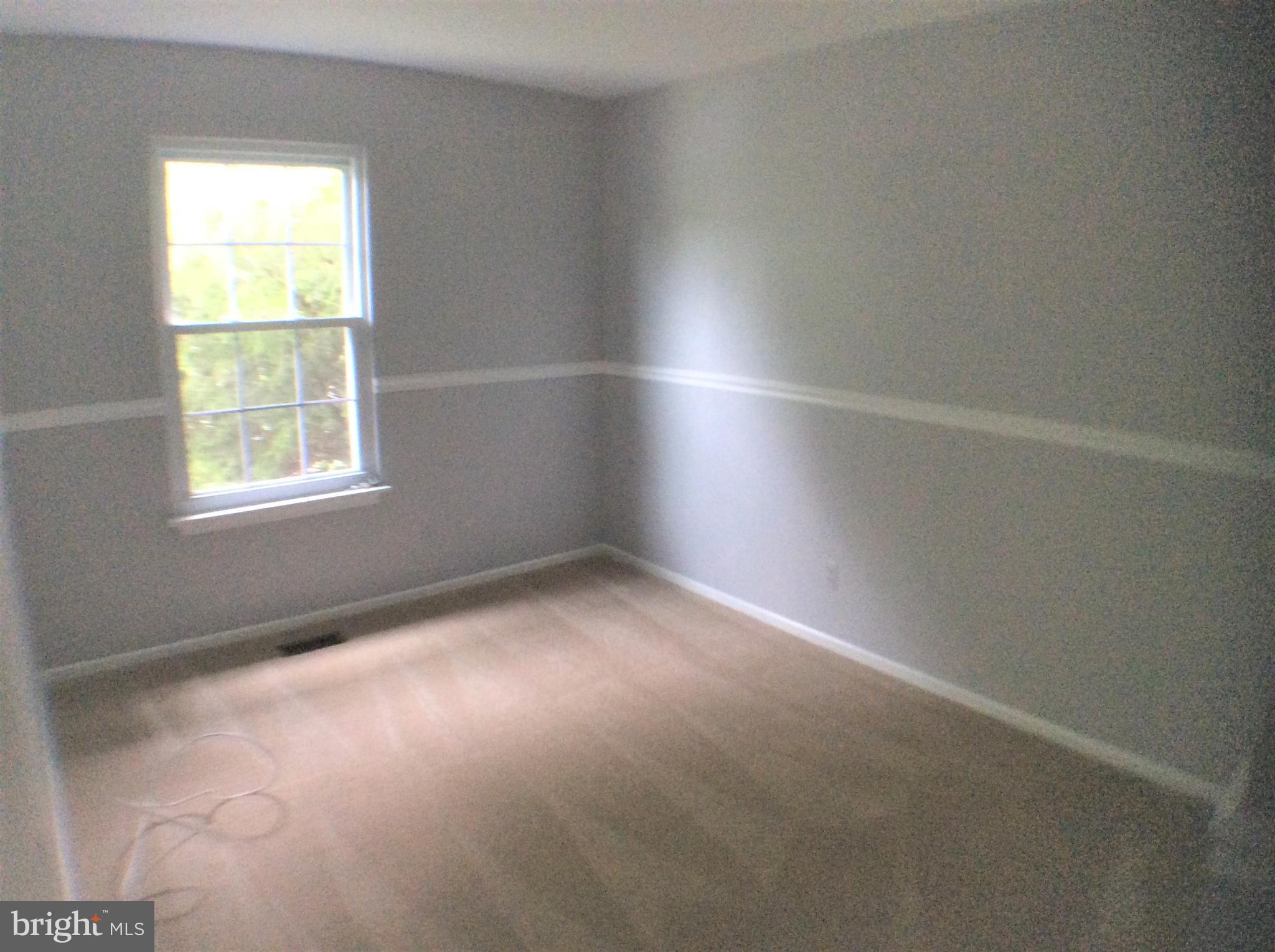 2021 Putnam Road Baltimore, MD 21227 - Photo 17 of 18 an empty room with a window