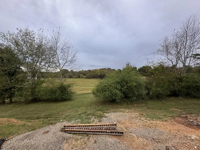a view of a lake with a yard