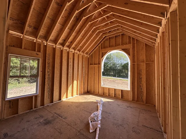 a view of a livingroom with furniture and staircase