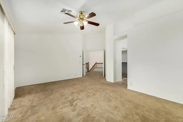 a view of walk in closet with empty racks