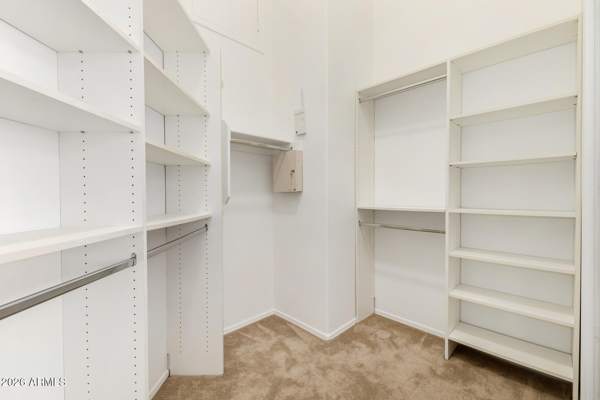 3962 East Agave Road Phoenix, AZ 85044 - Photo 22 of 54 a view of walk in closet with empty racks