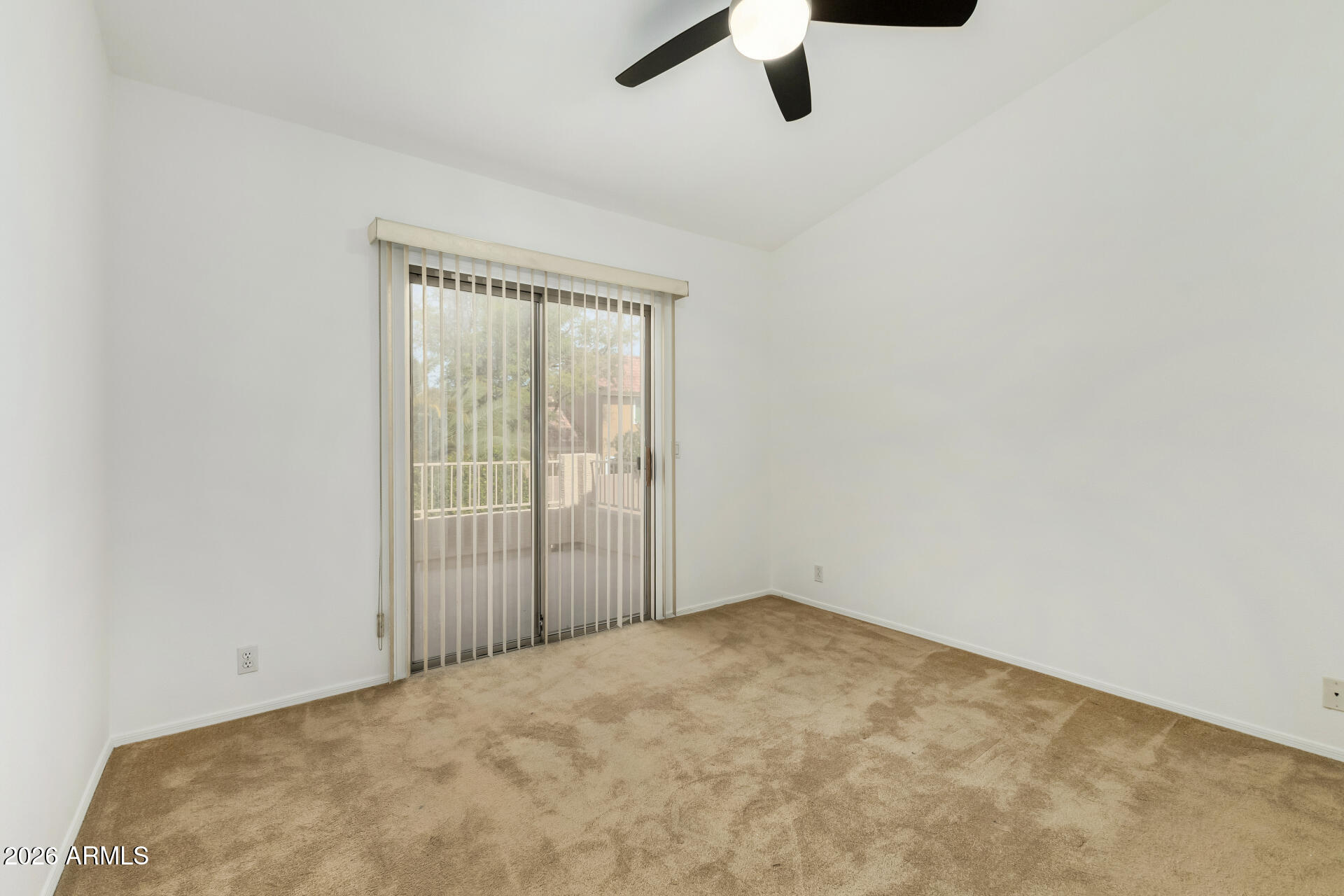 3962 East Agave Road Phoenix, AZ 85044 - Photo 25 of 54 an empty room with a ceiling fan and window