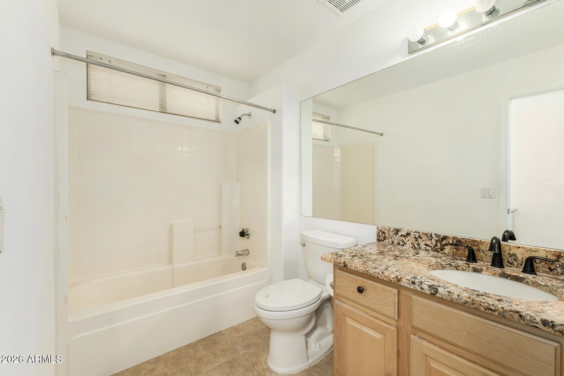 3962 East Agave Road Phoenix, AZ 85044 - Photo 27 of 54 a bathroom with a granite countertop sink toilet and shower