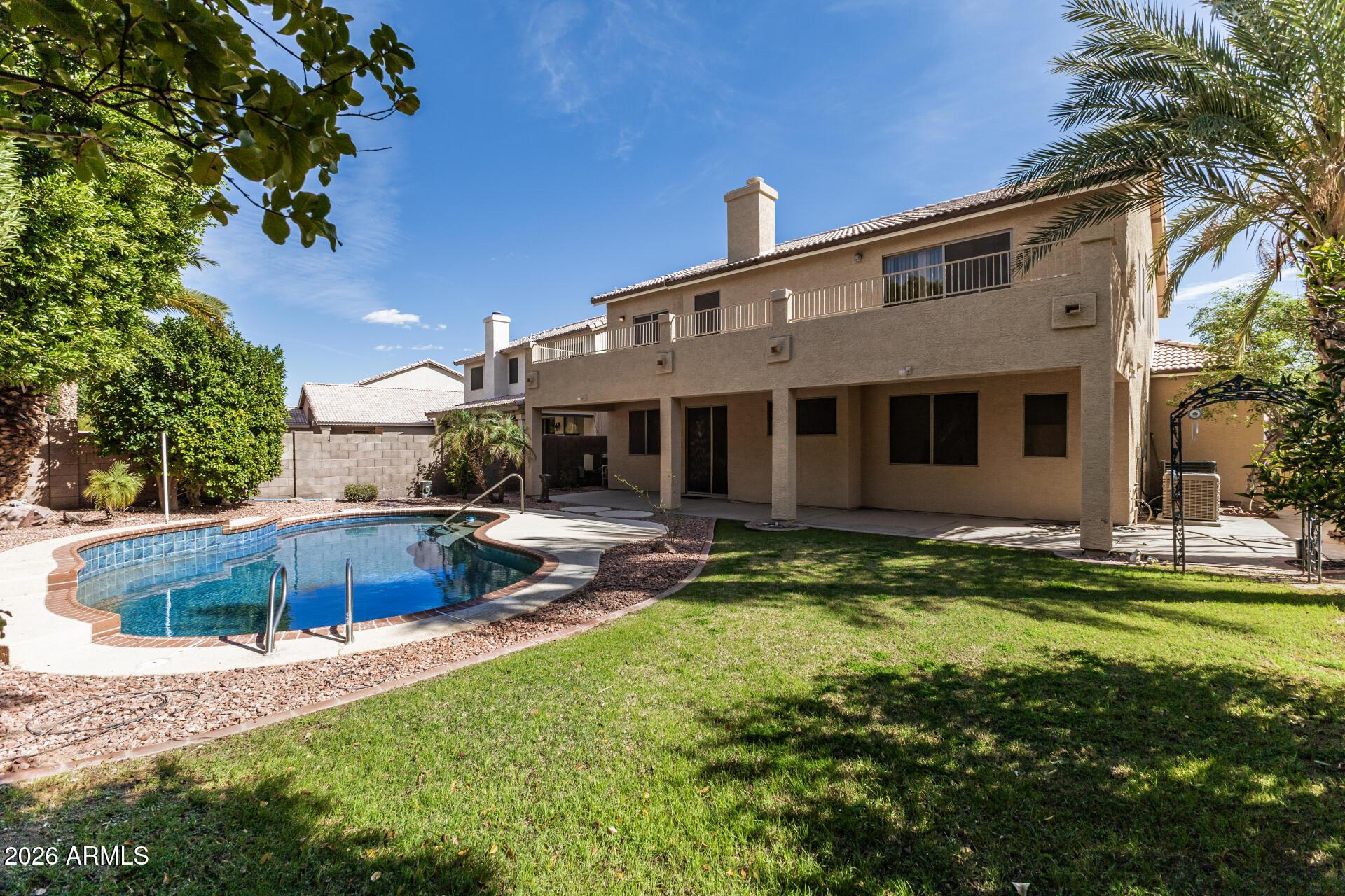 3962 East Agave Road Phoenix, AZ 85044 - Photo 3 of 54 a view of a house with a yard patio and swimming pool