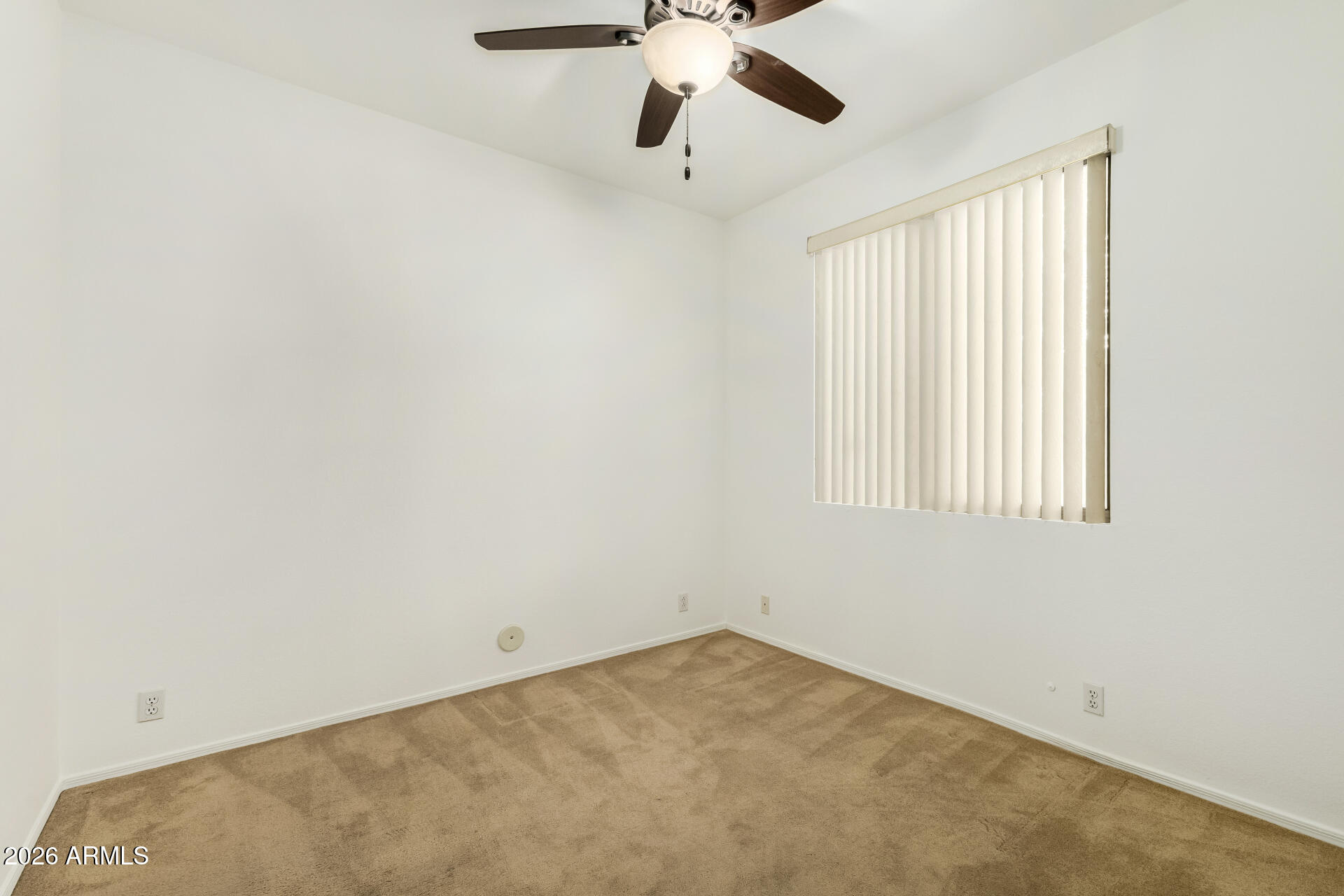 3962 East Agave Road Phoenix, AZ 85044 - Photo 31 of 54 an empty room with a window and a fan