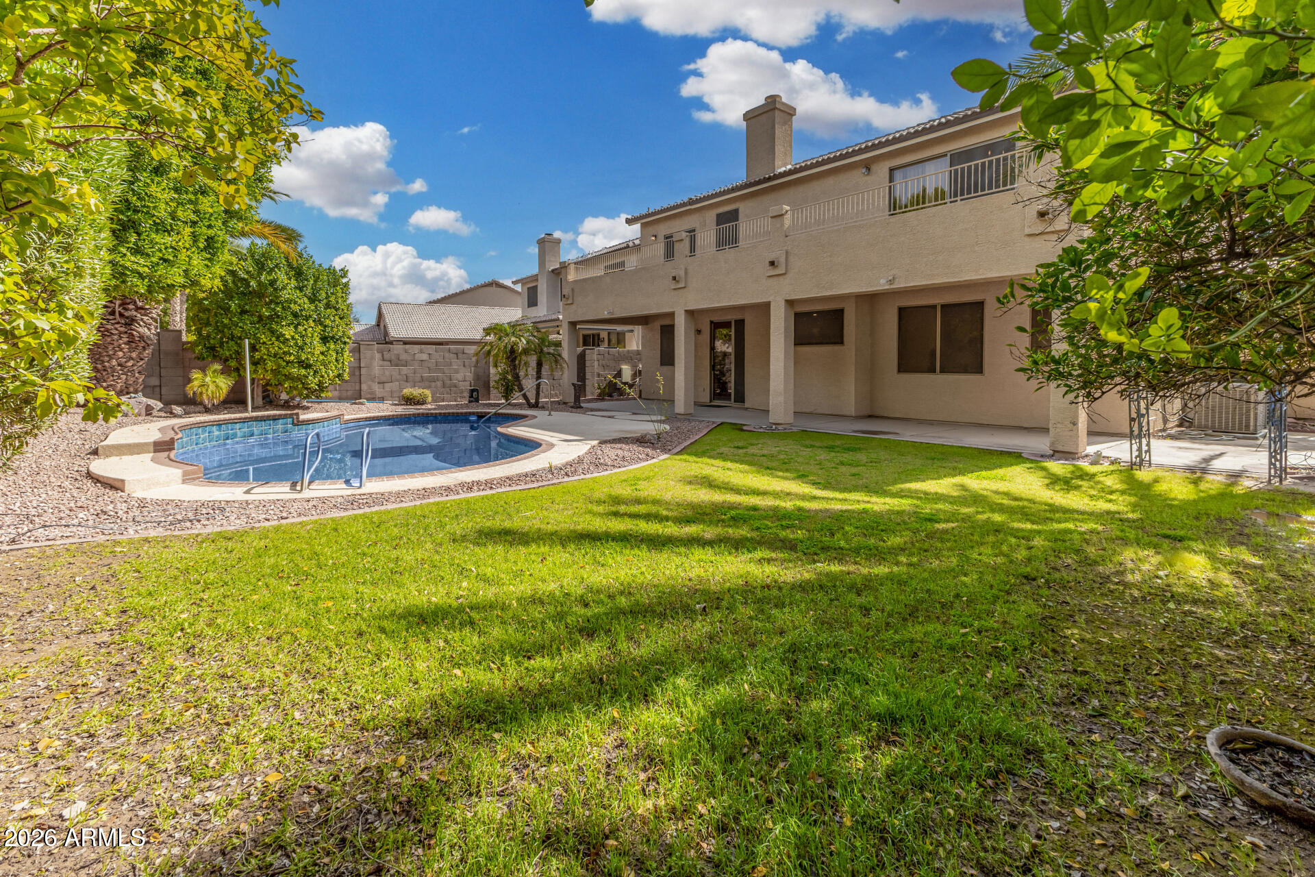 3962 East Agave Road Phoenix, AZ 85044 - Photo 39 of 54 a view of a house with a swimming pool