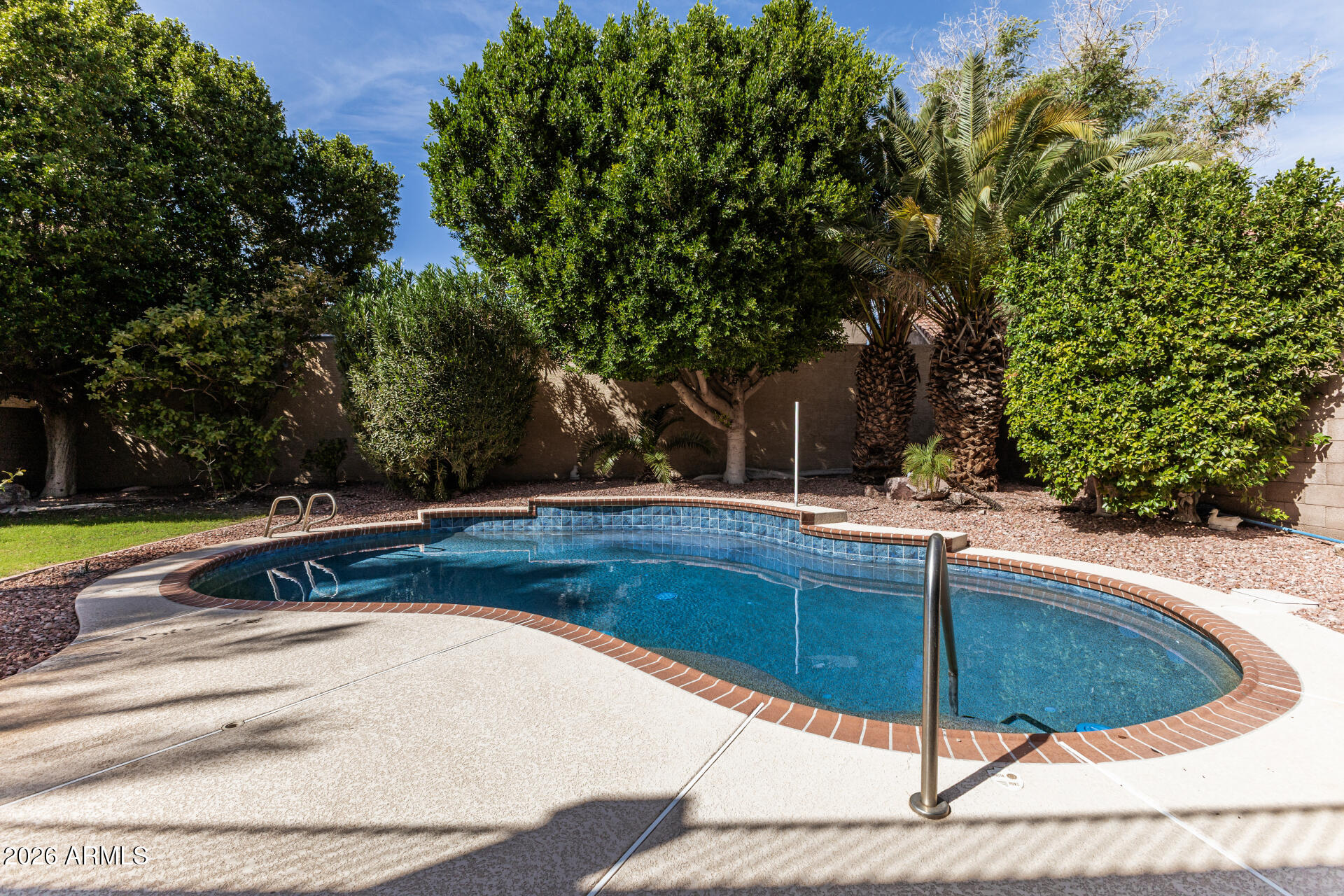 3962 East Agave Road Phoenix, AZ 85044 - Photo 44 of 54 a view of backyard with swimming pool and outdoor space