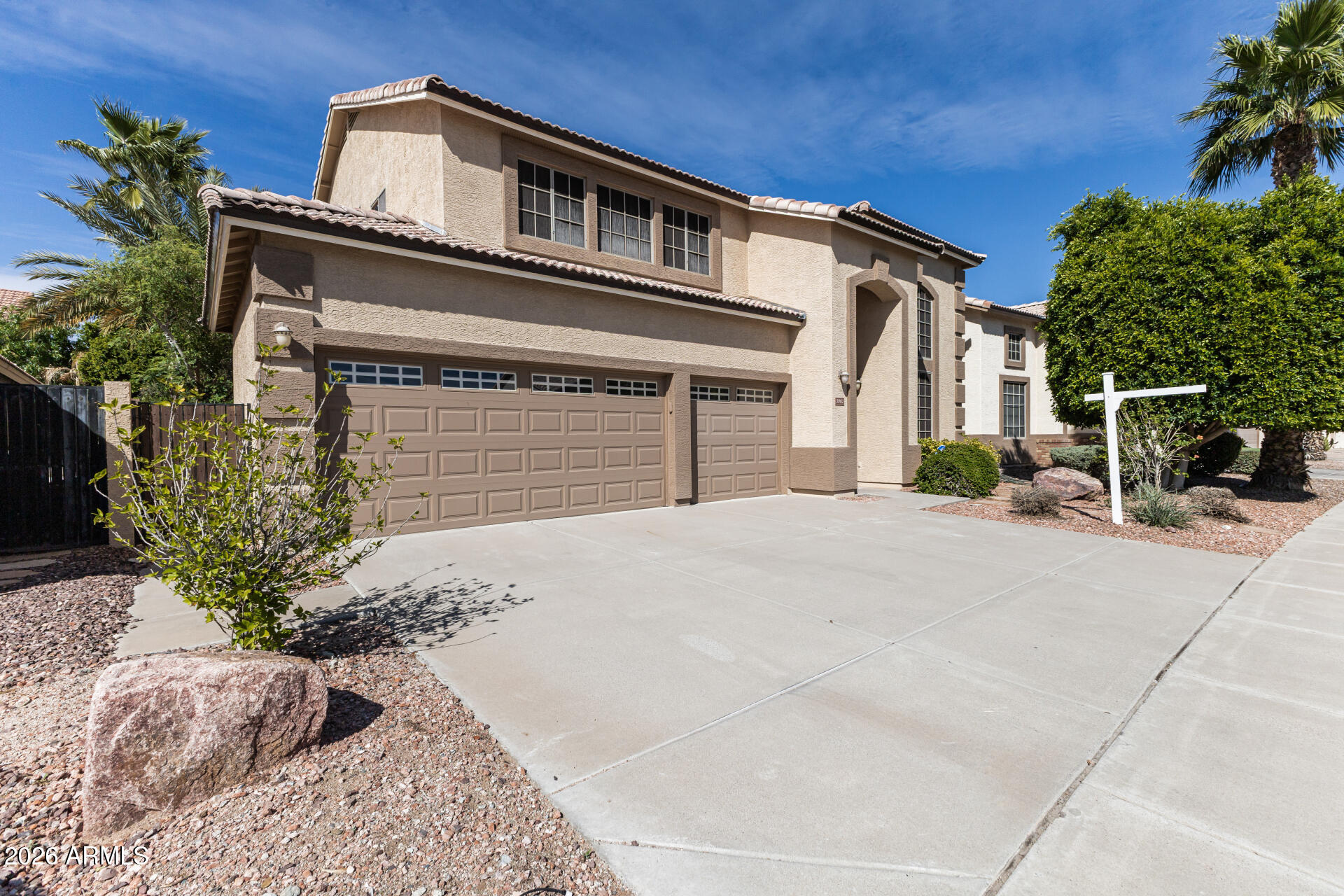 3962 East Agave Road Phoenix, AZ 85044 - Photo 46 of 54 a front view of a house with a yard