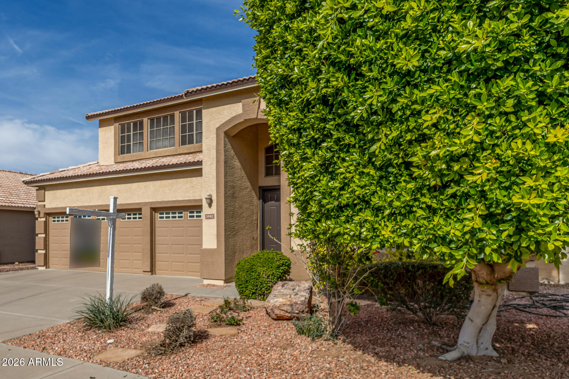 3962 East Agave Road Phoenix, AZ 85044 - Photo 53 of 54 a front view of a house with garden